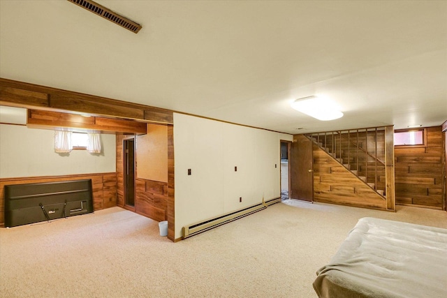 1117 W Springfield Ave, Champaign, IL 61821 - below grade area with wooden walls, a baseboard radiator, carpet floors, and stairs