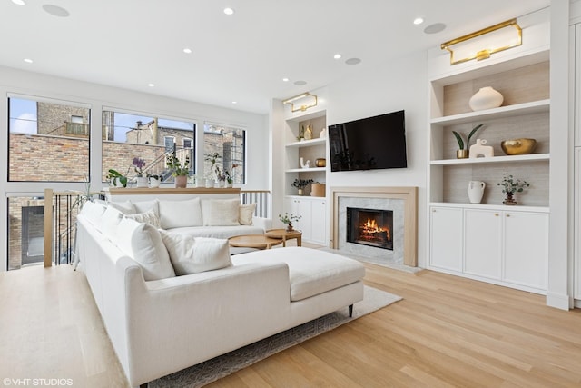 2014 N Winchester Ave, Chicago, IL 60614 - living area with a premium fireplace, plenty of natural light, light wood finished floors, and recessed lighting