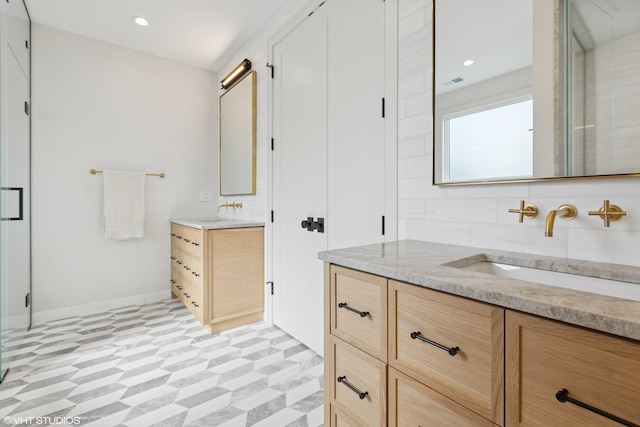 2014 N Winchester Ave, Chicago, IL 60614 - bathroom with two vanities, baseboards, tile patterned floors, a stall shower, and recessed lighting