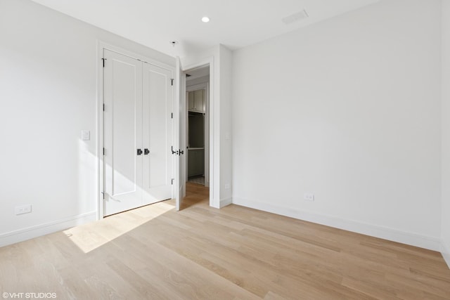 2014 N Winchester Ave, Chicago, IL 60614 - unfurnished bedroom featuring baseboards, light wood-type flooring, a closet, and recessed lighting