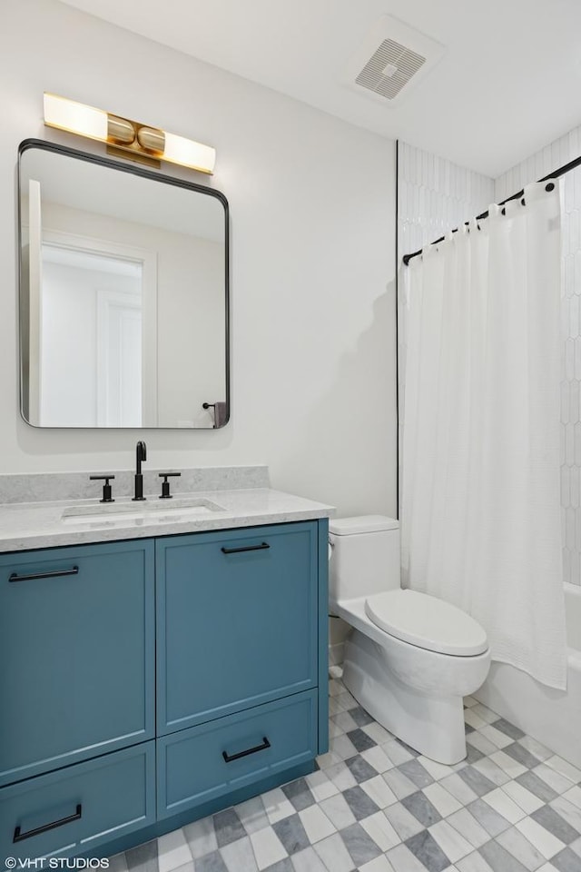 2014 N Winchester Ave, Chicago, IL 60614 - full bathroom with toilet, vanity, tile patterned floors, and shower / tub combo