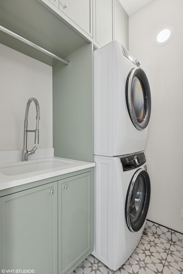 2014 N Winchester Ave, Chicago, IL 60614 - washroom with stacked washer / drying machine, cabinet space, and light flooring