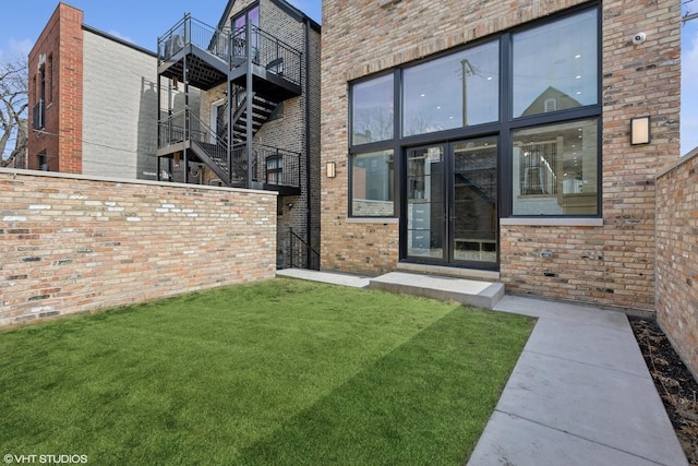 2014 N Winchester Ave, Chicago, IL 60614 - view of exterior entry featuring a lawn and brick siding