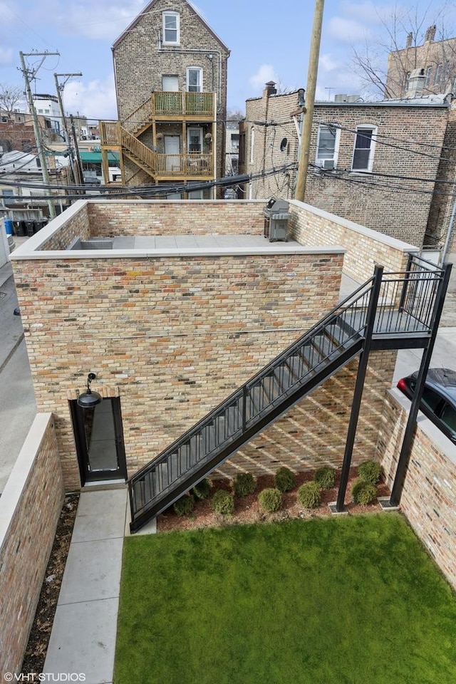 2014 N Winchester Ave, Chicago, IL 60614 - exterior space featuring stairway and brick siding