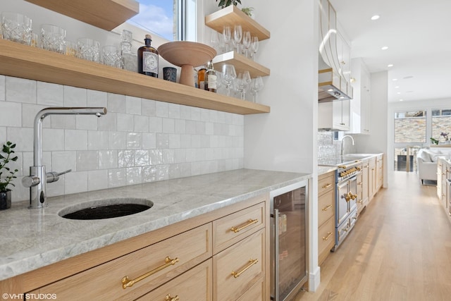 2014 N Winchester Ave, Chicago, IL 60614 - kitchen with open shelves, wine cooler, a sink, tasteful backsplash, and light wood-style floors