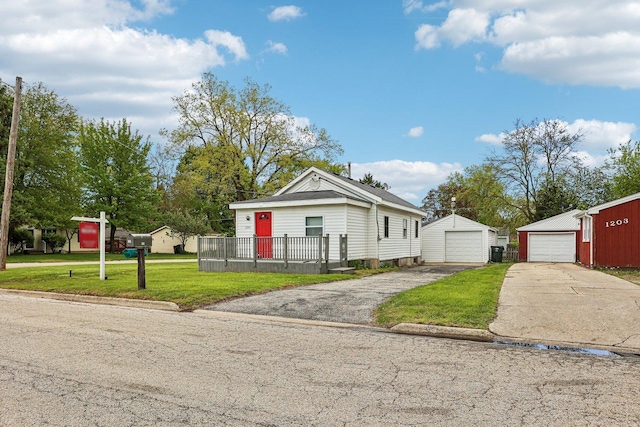 1201 Franklin Ave, Winthrop Harbor, IL 60096 - shotgun-style home featuring a detached garage, a front yard, an outdoor structure, and driveway