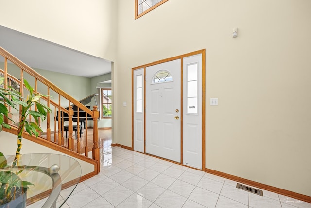 2048 Westbury Dr, Woodridge, IL 60517 - foyer featuring stairs, light tile patterned flooring, and a high ceiling