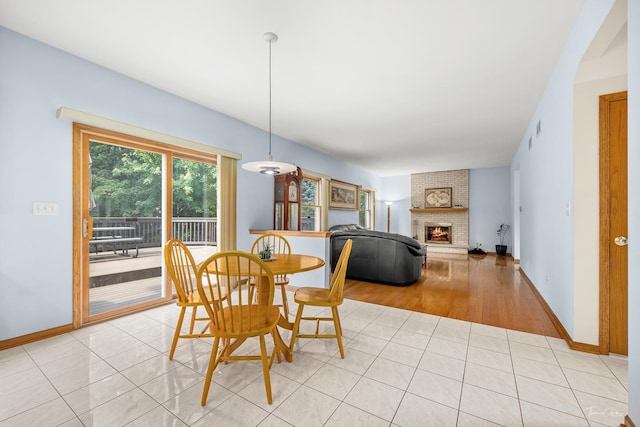 2048 Westbury Dr, Woodridge, IL 60517 - dining area featuring a fireplace and light tile patterned floors