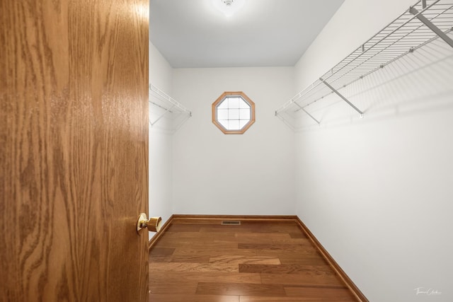 2048 Westbury Dr, Woodridge, IL 60517 - walk in closet featuring wood finished floors