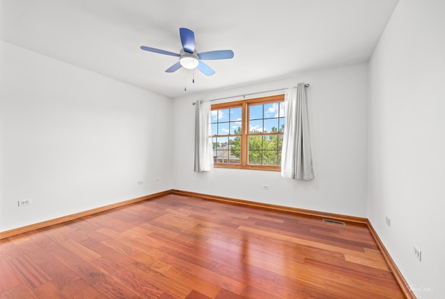 2048 Westbury Dr, Woodridge, IL 60517 - spare room featuring wood finished floors and a ceiling fan
