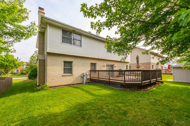 2048 Westbury Dr, Woodridge, IL 60517 - rear view of property with a chimney, a wooden deck, brick siding, and a lawn