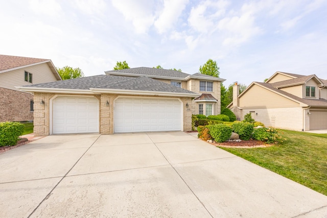 2048 Westbury Dr, Woodridge, IL 60517 - view of front of house featuring a garage, concrete driveway, brick siding, and a shingled roof