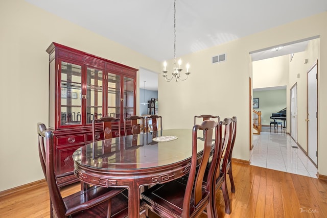 2048 Westbury Dr, Woodridge, IL 60517 - dining space featuring a chandelier and light wood-style flooring