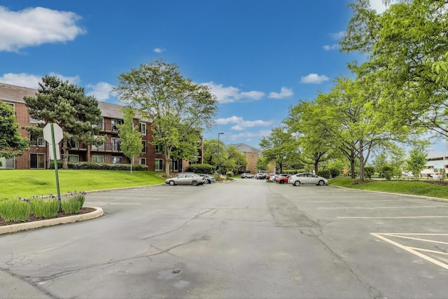 805 Leicester Rd Unit B105, Elk Grove Village, IL 60007 - view of asphalt street featuring curbs and traffic signs