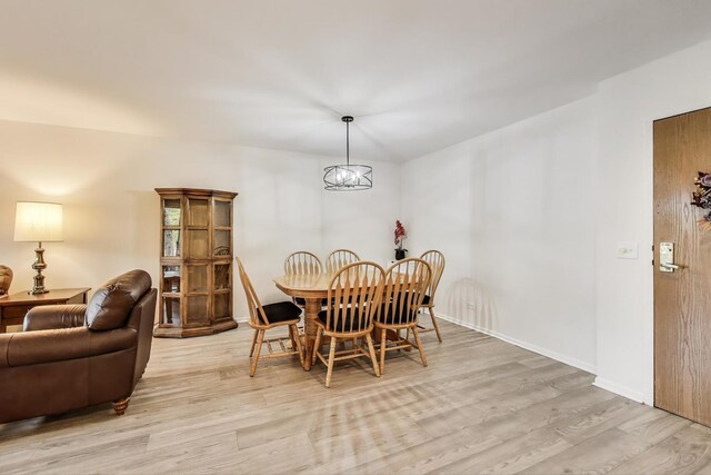 805 Leicester Rd Unit B105, Elk Grove Village, IL 60007 - dining space with light wood-style floors and baseboards