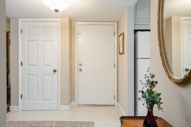 1700 Northfield Sq Unit C, Northfield, IL 60093 - entryway with baseboards and light tile patterned floors