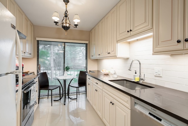 1700 Northfield Sq Unit C, Northfield, IL 60093 - kitchen featuring a sink, stainless steel appliances, cream cabinets, light tile patterned flooring, and tasteful backsplash