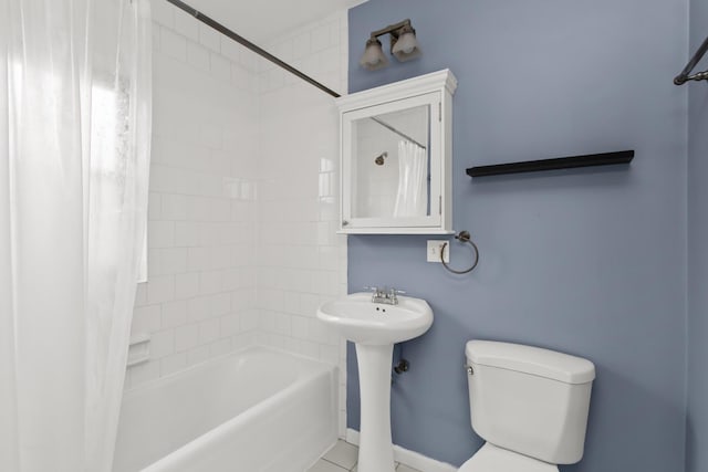 7444 Adams St Unit 3E, Forest Park, IL 60130 - bathroom featuring shower / bath combo with shower curtain and tile patterned flooring