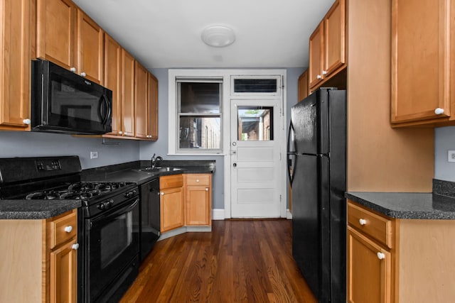 7444 Adams St Unit 3E, Forest Park, IL 60130 - kitchen with black appliances, dark wood-style flooring, dark countertops, and brown cabinets