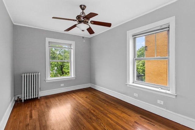 7444 Adams St Unit 3E, Forest Park, IL 60130 - unfurnished room with radiator, dark wood-style flooring, ornamental molding, and ceiling fan