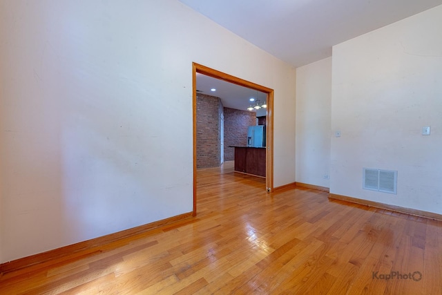 4137 S Prairie Ave Unit 3, Chicago, IL 60653 - empty room featuring baseboards and light wood-style flooring