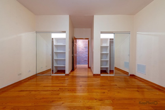 4137 S Prairie Ave Unit 3, Chicago, IL 60653 - unfurnished bedroom with baseboards and light wood-style flooring