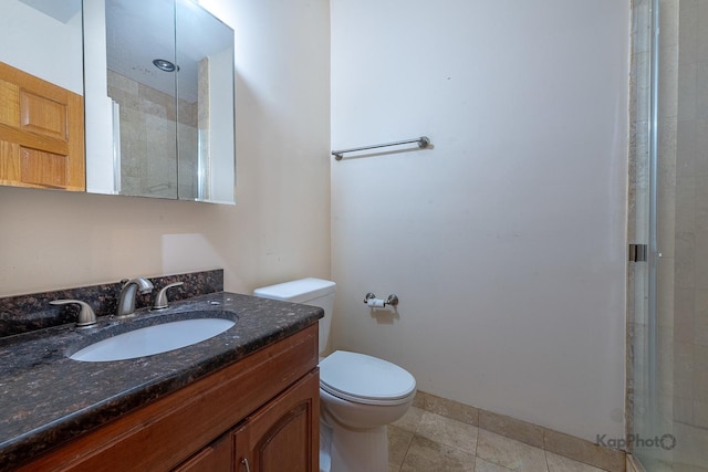4137 S Prairie Ave Unit 3, Chicago, IL 60653 - bathroom with toilet, vanity, a tile shower, and baseboards