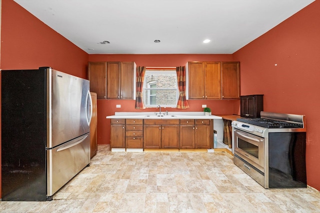 7809 S Peoria, Chicago, IL 60620 - kitchen featuring appliances with stainless steel finishes, brown cabinetry, light countertops, a sink, and stone finish flooring