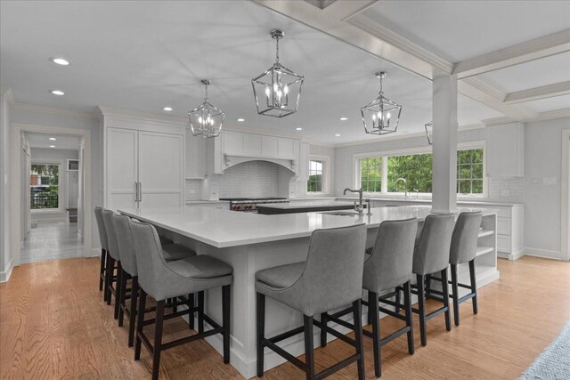 1410 Wincanton Dr, Deerfield, IL 60015 - kitchen featuring a chandelier, white cabinets, decorative backsplash, light countertops, and recessed lighting