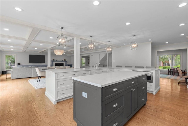 1410 Wincanton Dr, Deerfield, IL 60015 - kitchen featuring a spacious island, a chandelier, white cabinetry, plenty of natural light, and coffered ceiling