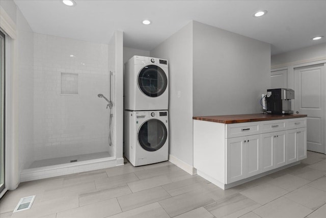 1410 Wincanton Dr, Deerfield, IL 60015 - laundry room with stacked washer and clothes dryer and recessed lighting