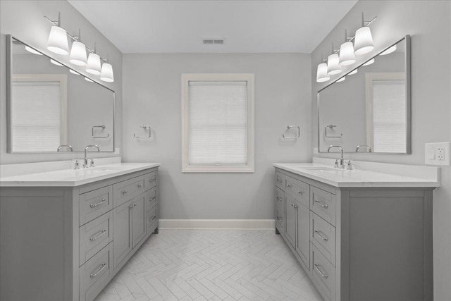 1410 Wincanton Dr, Deerfield, IL 60015 - full bathroom with two vanities and baseboards