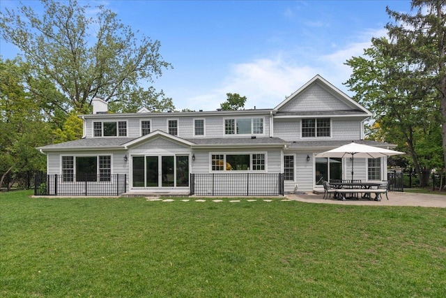 1410 Wincanton Dr, Deerfield, IL 60015 - rear view of house with a patio and a chimney
