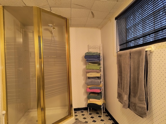 10153 S Saint Lawrence Ave, Chicago, IL 60628 - full bathroom featuring a stall shower, tile patterned floors, and a drop ceiling