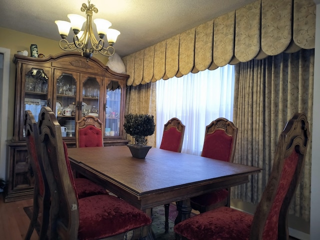 10153 S Saint Lawrence Ave, Chicago, IL 60628 - dining space with a chandelier and wood finished floors