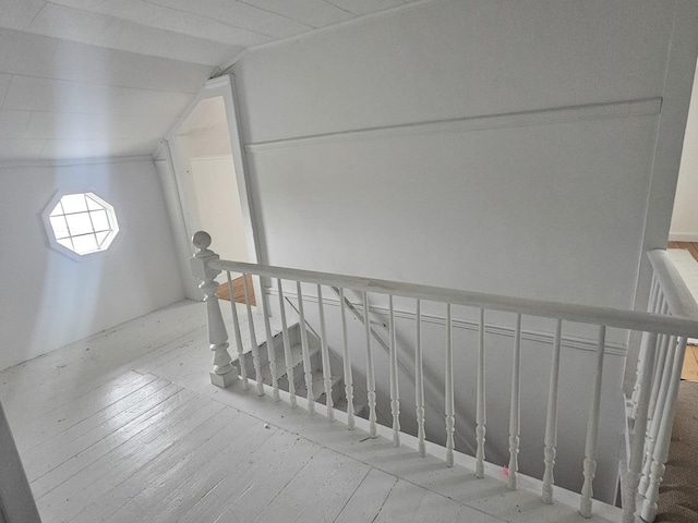 23018 Freeport Rd, Sterling, IL 61081 - staircase featuring hardwood / wood-style floors and vaulted ceiling