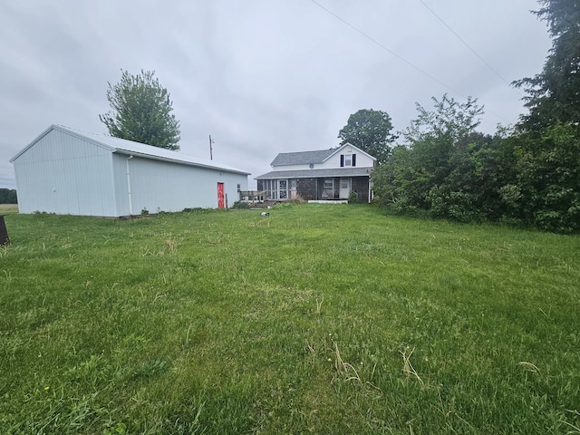 23018 Freeport Rd, Sterling, IL 61081 - view of grassy yard with a pole building and an outbuilding