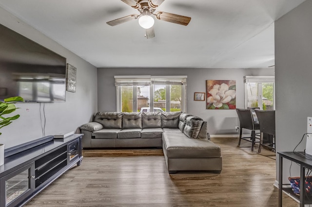 2816 E 127th St, Chicago, IL 60633 - living area with ceiling fan, wood finished floors, healthy amount of natural light, and baseboards
