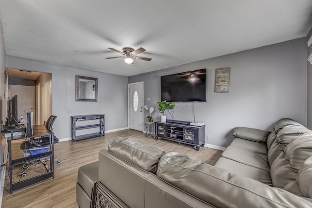 2816 E 127th St, Chicago, IL 60633 - living room featuring ceiling fan, baseboards, and light wood-style flooring