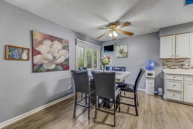 2816 E 127th St, Chicago, IL 60633 - dining space with light wood finished floors, ceiling fan, and baseboards
