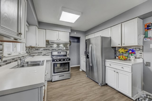 2816 E 127th St, Chicago, IL 60633 - kitchen featuring stainless steel appliances, a sink, decorative backsplash, and light countertops