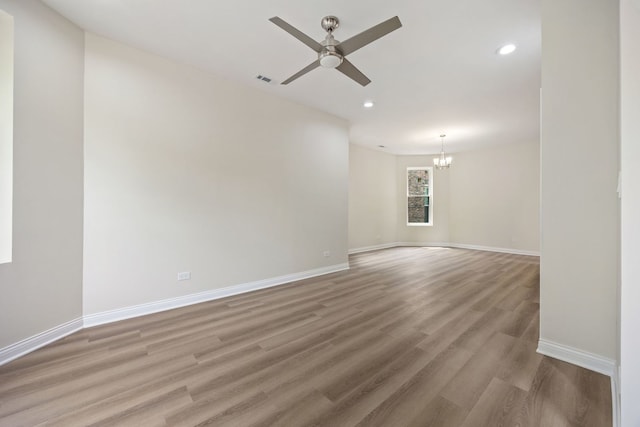 5622 S Laflin St, Chicago, IL 60636 - unfurnished room with a chandelier, light wood finished floors, recessed lighting, baseboards, and ceiling fan