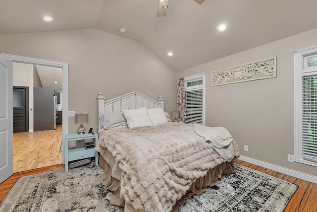 480 Logue Cir, Seneca, IL 61360 - bedroom featuring wood finished floors, vaulted ceiling, recessed lighting, ceiling fan, and freestanding refrigerator