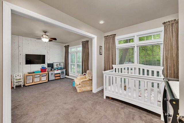 480 Logue Cir, Seneca, IL 61360 - carpeted bedroom with a crib, baseboards, and a ceiling fan
