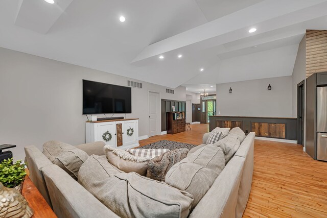 480 Logue Cir, Seneca, IL 61360 - living room with light wood-type flooring, recessed lighting, high vaulted ceiling, and baseboards