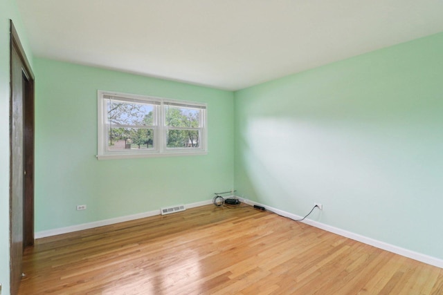 409 Wingate Dr, Schaumburg, IL 60193 - unfurnished bedroom featuring baseboards and light wood-style floors