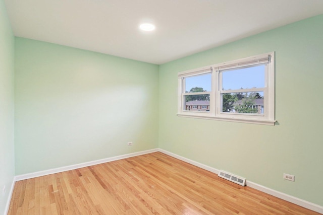 409 Wingate Dr, Schaumburg, IL 60193 - unfurnished room featuring baseboards and light wood-type flooring