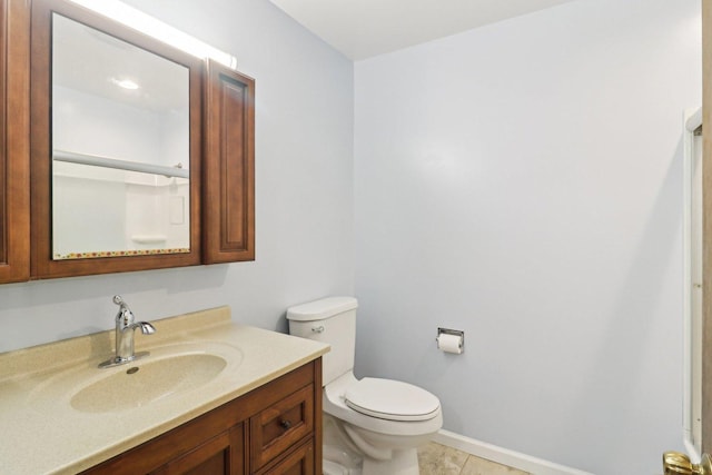 409 Wingate Dr, Schaumburg, IL 60193 - bathroom with toilet, vanity, tile patterned flooring, and baseboards
