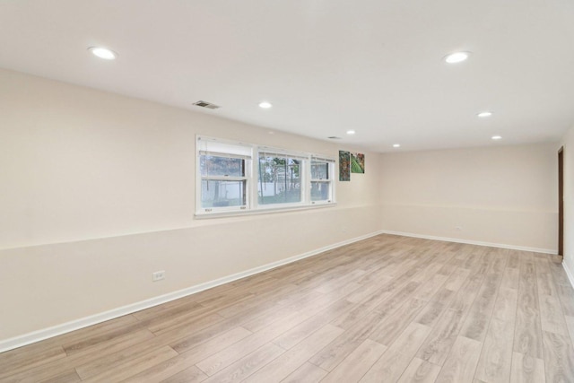 409 Wingate Dr, Schaumburg, IL 60193 - spare room featuring light wood-type flooring, baseboards, and recessed lighting