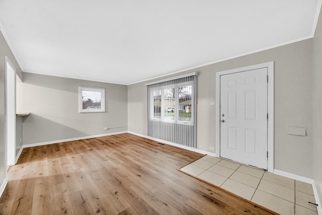 172 Nanti St, Park Forest, IL 60466 - foyer entrance featuring plenty of natural light, wood finished floors, baseboards, and crown molding